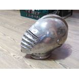 A Victorian reproduction of a German Maximilian style helmet with hinged up visor and side plates.