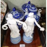 Wedgwood comprising a pair of lidded urns, a pedestal vase and two Dancing Hour figures.