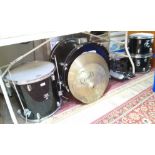 A CB drum kit comprising bass drum, two tom toms and floor tom, two cymbals, hi-hat, pedals and