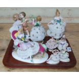 A group of nine Continental porcelain figures, tallest 19cm. Condition - various losses.