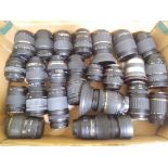 A box of 24 digital SLR cameras lenses, various manufacturers including Nikon, Tamron, Sigma,