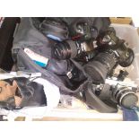 A box of cameras and accessories including Nikon F50, Nikon D70s, Praktica L2, Canon Powershot G6,