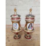 A pair of Continental porcelain pedestal vases and covers, decorated with Marie Antoinette and the