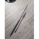 An African spear with carved wood handle together with an African spearhead.