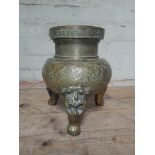 A Chinese bronze incense burner, archaic mark to base, height 26cm, missing handles.