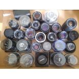 A box of assorted film camera lenses.
