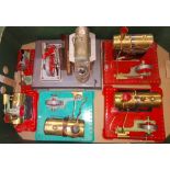 A box of assorted stationary live steam models comprising four Mamod engines and two accessories and