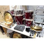 A Hohner drum kit comprising bass drum, two tom toms and a floor tom, snare, two cymbals, hi-hat,