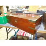 A 19th century mahogany writing slope with campaign style inset brass handles and inlaid brass