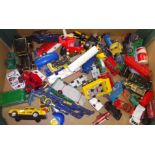 A box of mainly die-cast model vehicles.