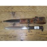 A Swedish Mauser M1896 knife bayonet with scabbard and frog.
