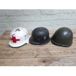 A reproduction WW2 German M40 M-1940 helmet, ORG. TODT. together with a possibly Italian helmet,