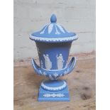 A Wedgwood blue and white Jasper ware lidded pedestal urn, height 29cm.