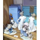 Three Lladro figures, two Nao figures and a Wedgwood Peter Rabbit nursery set.