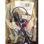 A box of militaria to include headphones, various related items, whistles, scope, a William