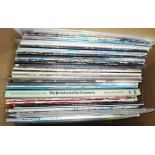 A box of mainly prog rock LPs.