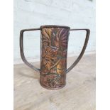 An Arts & Crafts copper twin handled vase, designed by John Williams with hammered decoration
