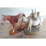 A Royal Dux figure group modelled as two donkeys, together with a Beswick horse 'Grundy'.