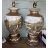 A pair of Japanese Satsuma lamp bases (converted from vases), height 41cm.