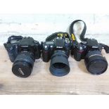 Three digital cameras; Nikon D5200 with Tamron 50mm lens, Nikon D90 with Nikkor 50mm, and Canon