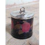 A Moorcroft pomegranate preserve jar with silver plated cover, height 9.5cm.