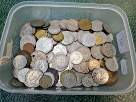 A tub of assorted world coins.