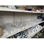 A large collection of glassware including decanters, drinking glasses, jugs etc. Over 100 pieces