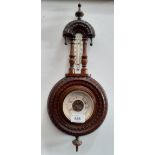 A late 19th century carved oak barometer.