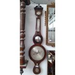 A late Georgian banjo barometer in mahogany case with thermometer and convex glass mirror.