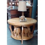 A nesting elephant table and matching table lamp.