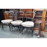 A set of three Victorian ebonised and parcel gilt chairs and an Old Charm oak pedestal table.