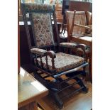 An early 20th century American style rocking chair.