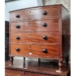 A Regency bow front mahogany chest of drawers with ebonised handles, reeded detail to top and