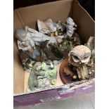 A box with Border Fine Arts and Nao figures.