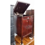 A 1920s/30s 'Trutone' cabinet gramophone containing a number of old of old records.