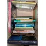 A box of assorted tennis books.