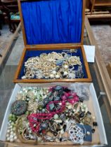 Two boxes of costume jewellery.