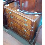 A continental walnut chest of drawers, the lower drawers having Wellington type locking mechanism,