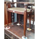 An Edwardian inlaid mahogany piano stool.