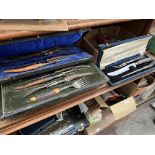 3 cased horn handled carving sets with silver collars.