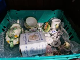 A box of ornaments to include Beatrix Potter, Bramley Hedge and Hammersley miniatures.