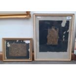 Two religious gilt rubbings on black paper, a nativity scene and Jesus on the cross in front of a