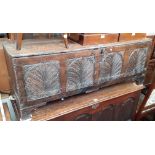 A 17th century and later carved oak coffer, length 138cm.