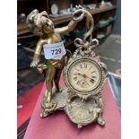 Brass mounted wind up clock, Rococo style with cherub, possibly New Haven