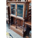 An oak and leaded glass display cabinet, height 150cm, width 105cm and depth 33.5cm.