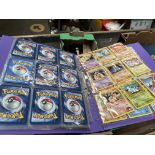 A folder of Pokemon cards from 1999 to 2001 sets including 18 holos, approx 80 in total.