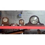 3 mantel clocks and a barometer.