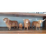 4 Beswick Highland Cattle figures. 2 bulls, 1 cow and a calf