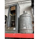 A paraffin heater and a galvanised drum.
