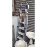 A set of 3 way ladder and another aluminium stepladder.